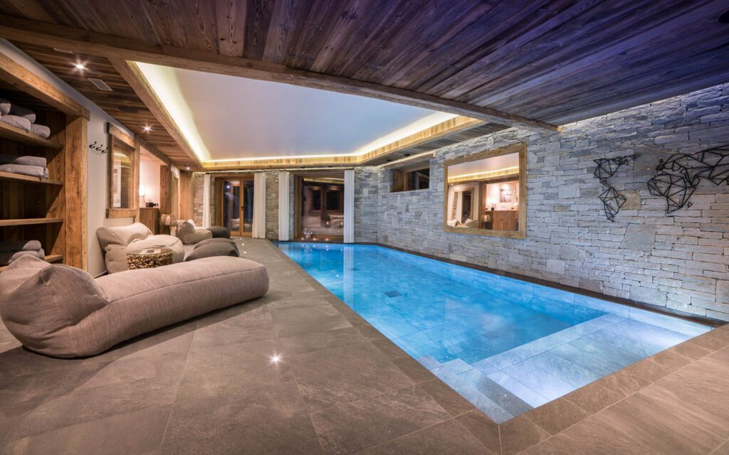 14 Swimming Pool By Night, The Finest Luxury Ski Chalets &amp; Villas - Firefly Collection