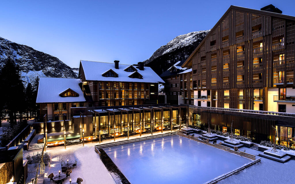 The Chedi Dining The Courtyard Ice Rink Winter Evening, The Finest Luxury Ski Chalets &amp; Villas - Firefly Collection